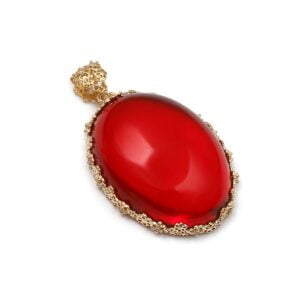 Classic gold amber pendant in the shape of a cherry-colored cabochon, with zircons